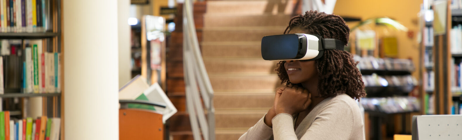 Excited female student watching virtual video