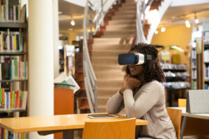 Excited female student watching virtual video
